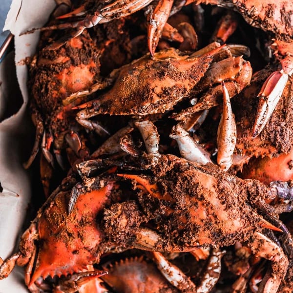 Close-up of steamed blue crabs seasoned with Old Bay, ready to be served at Charm City Seafood.